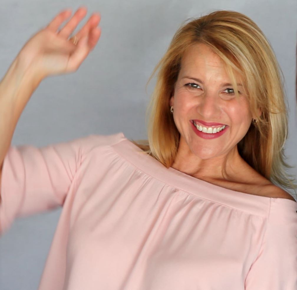 Janine Louise conducting a reading